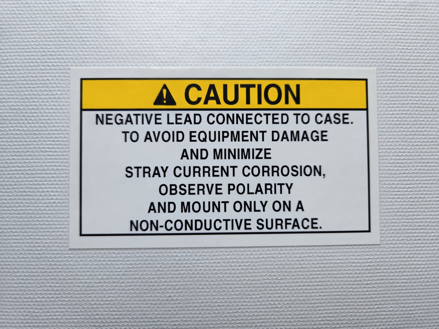Negative Lead Connected to Case Caution Label (1) (our #126)
