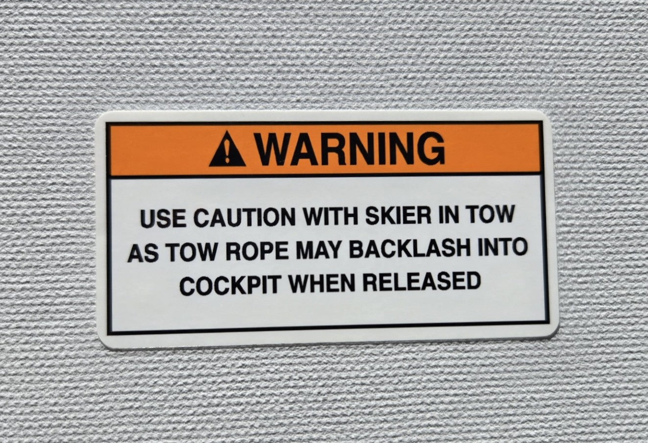 Skier in Tow Warning Label (our #173)