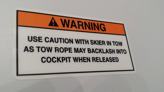 Skier in Tow Warning Label (our #173)